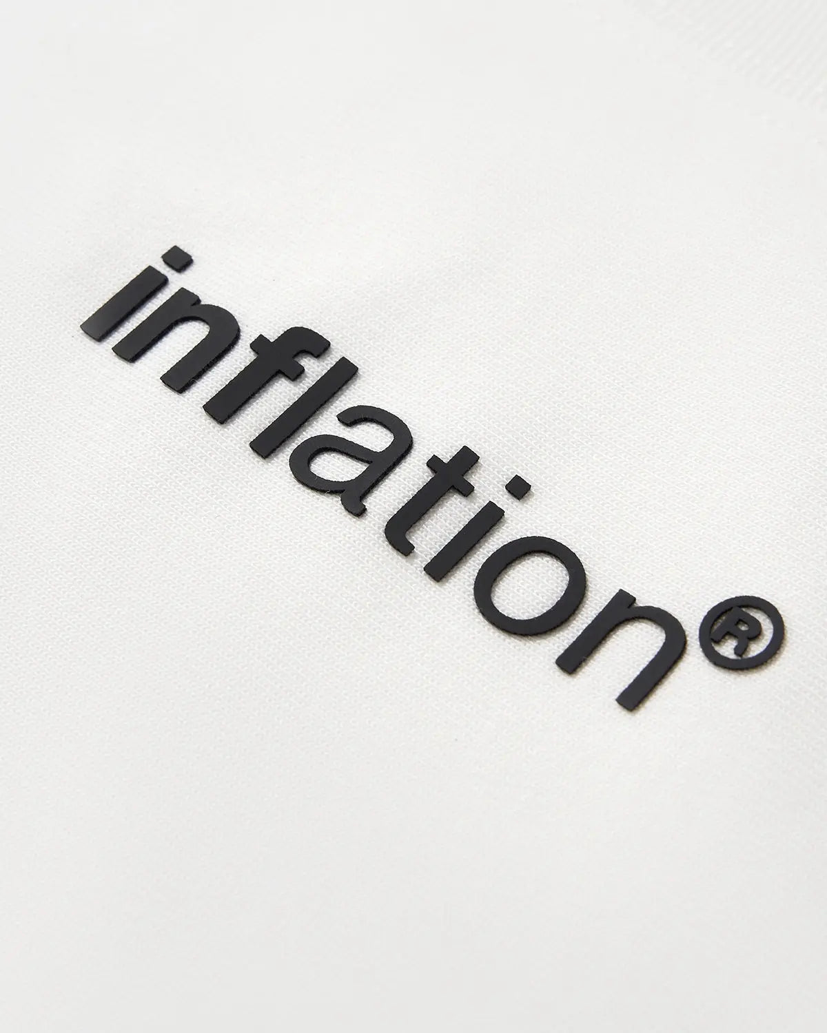 White cotton T-shirt with inflation logo print, casual streetwear tee, soft fabric, and classic fit.