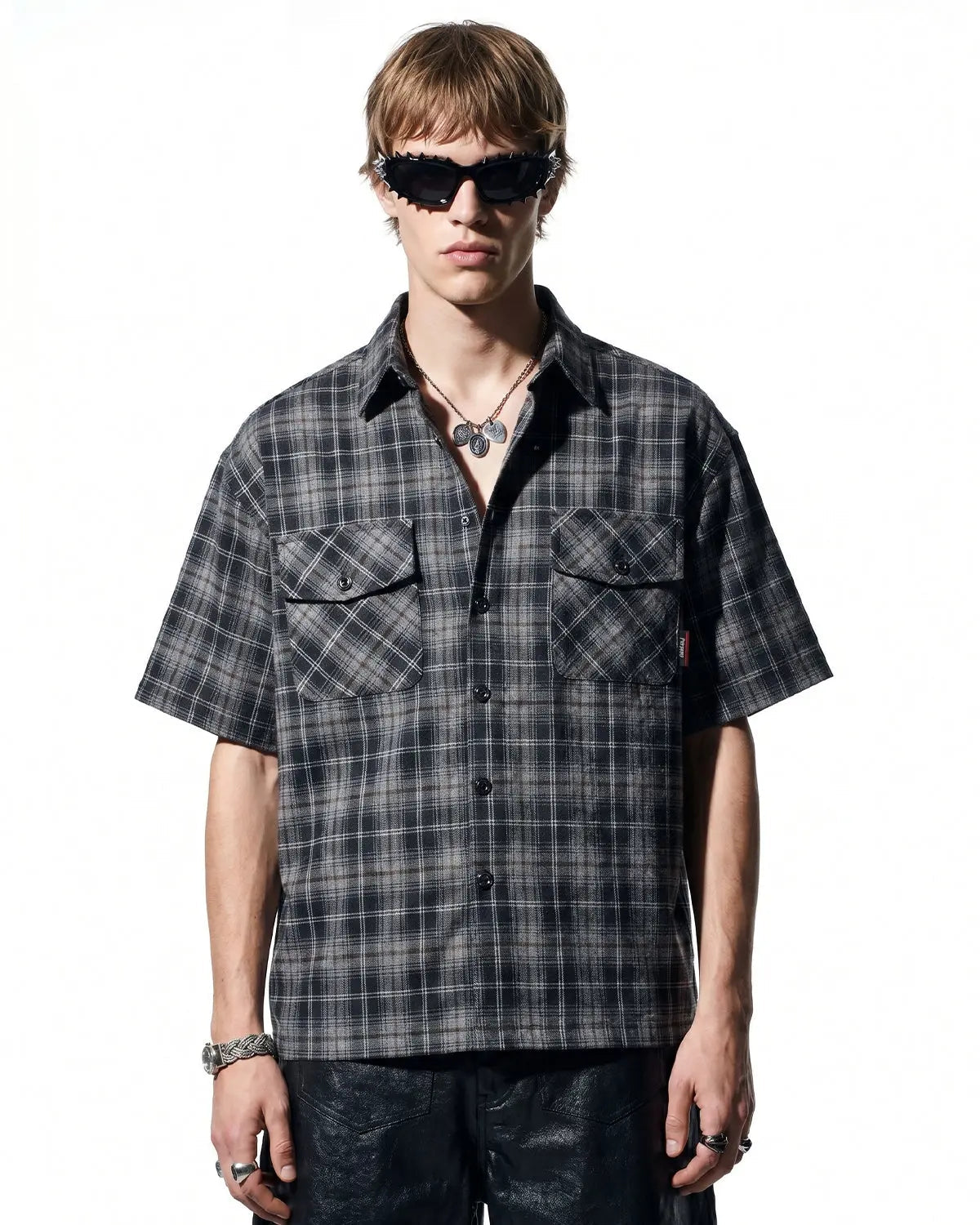 Inflation Streetwear plaid script embroidered shirt featuring a classic checkered pattern and embroidered branding on the front.