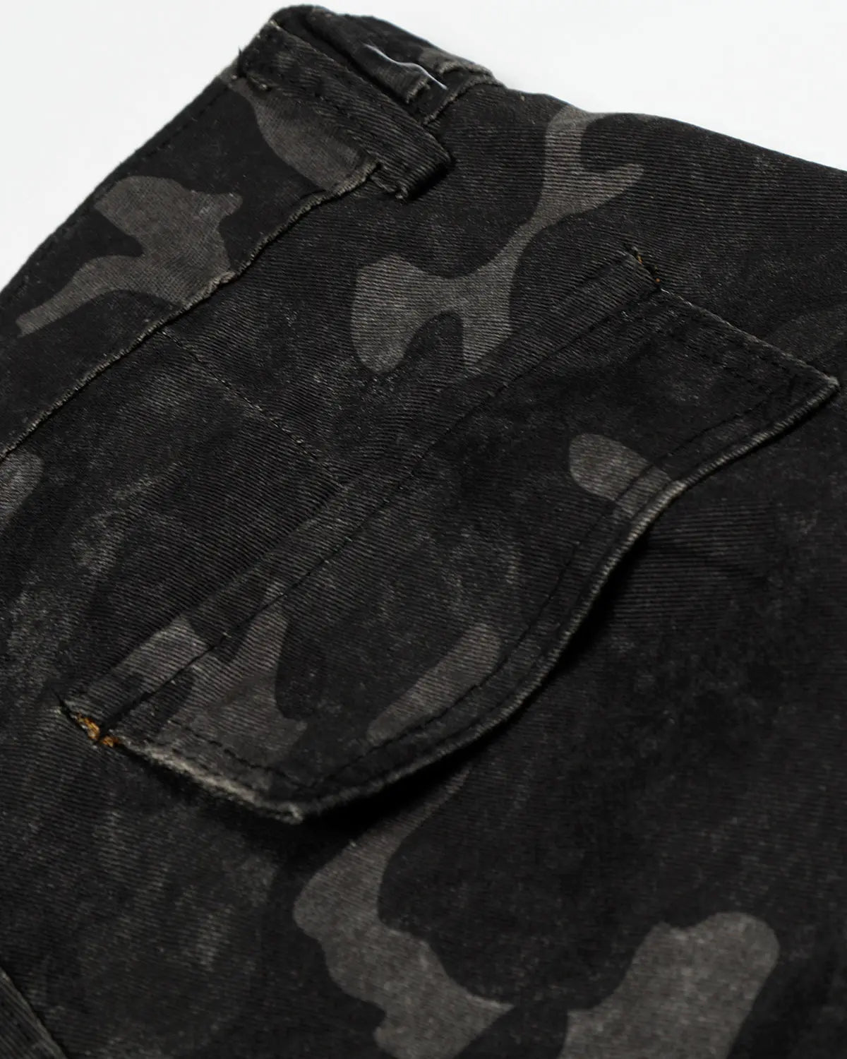 Dark camo cargo shorts by INFLATION, casual streetwear pants with multiple pockets and a relaxed fit, shown on a model.