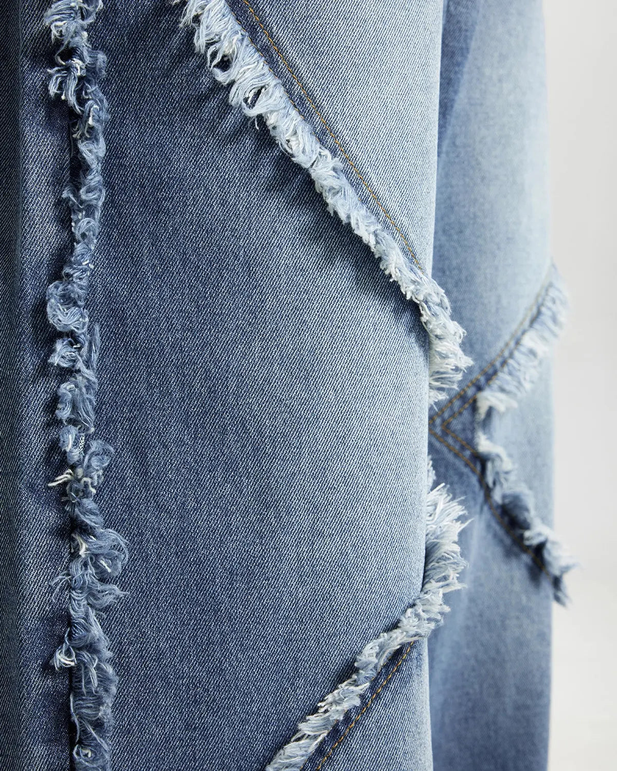 Blue frayed acid wash jeans from Inflation Streetwear featuring distressed details and a relaxed fit.