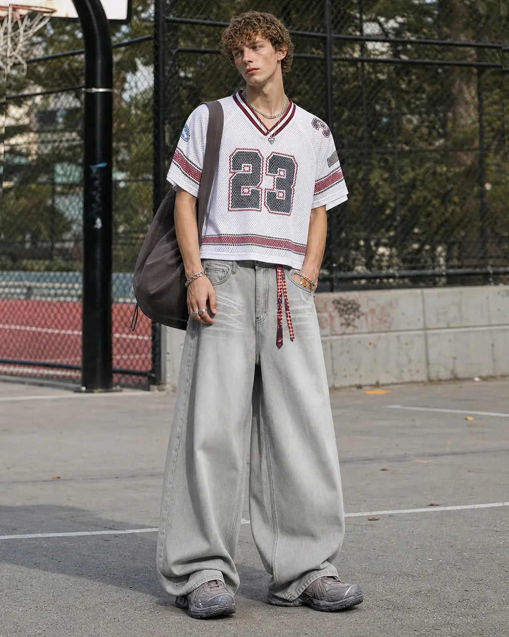 Washed distressed baggy jeans by INFLATION featuring a relaxed fit, ripped details, and a casual streetwear style.