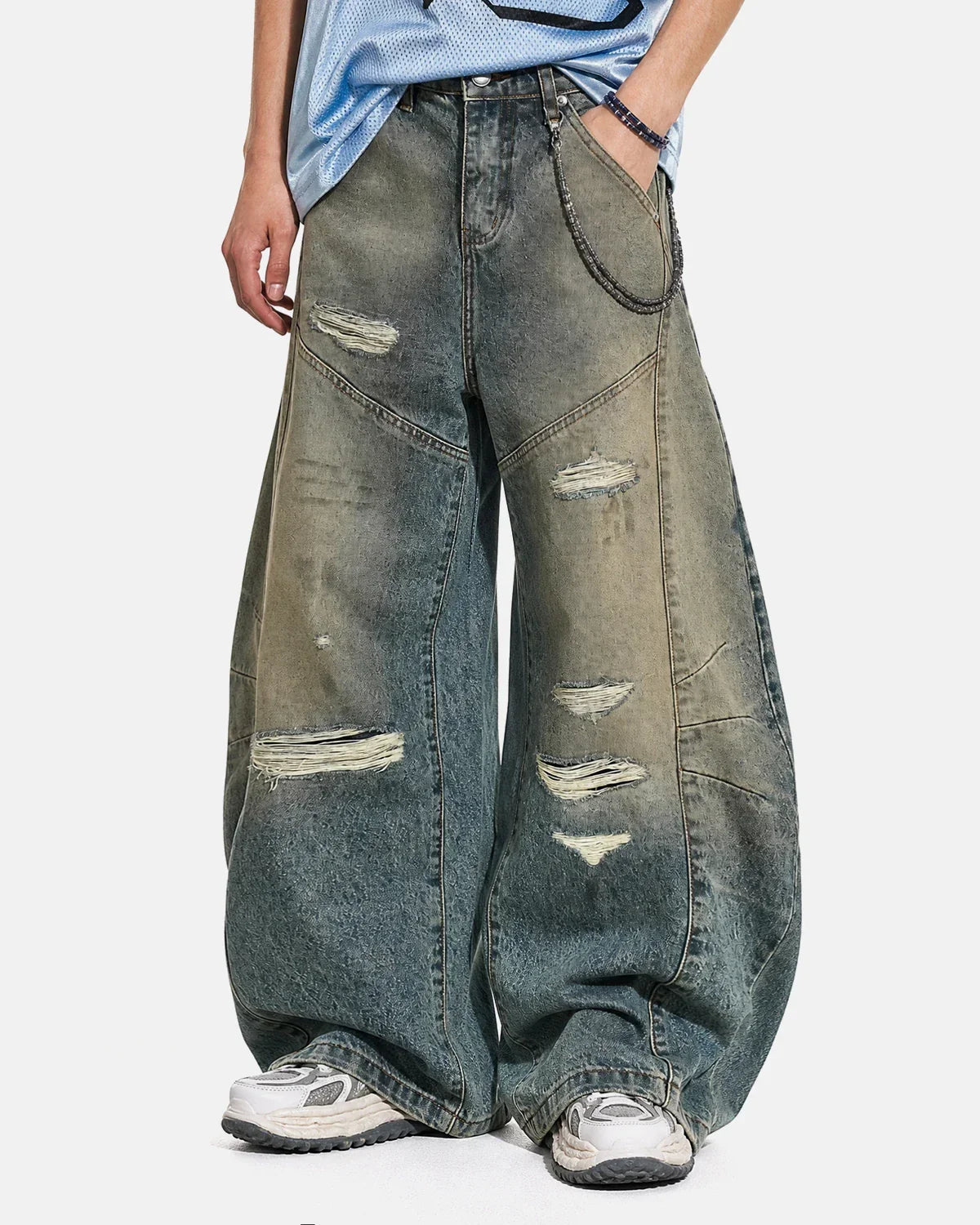 Distressed dirty wash barrel jeans by INFLATION featuring a relaxed fit, rugged distressed details, and vintage-inspired style.