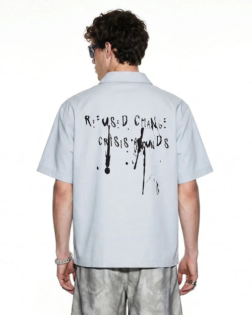 Abstract graphic printing shirt by INFLATION featuring bold, colorful geometric designs on a casual streetwear shirt.