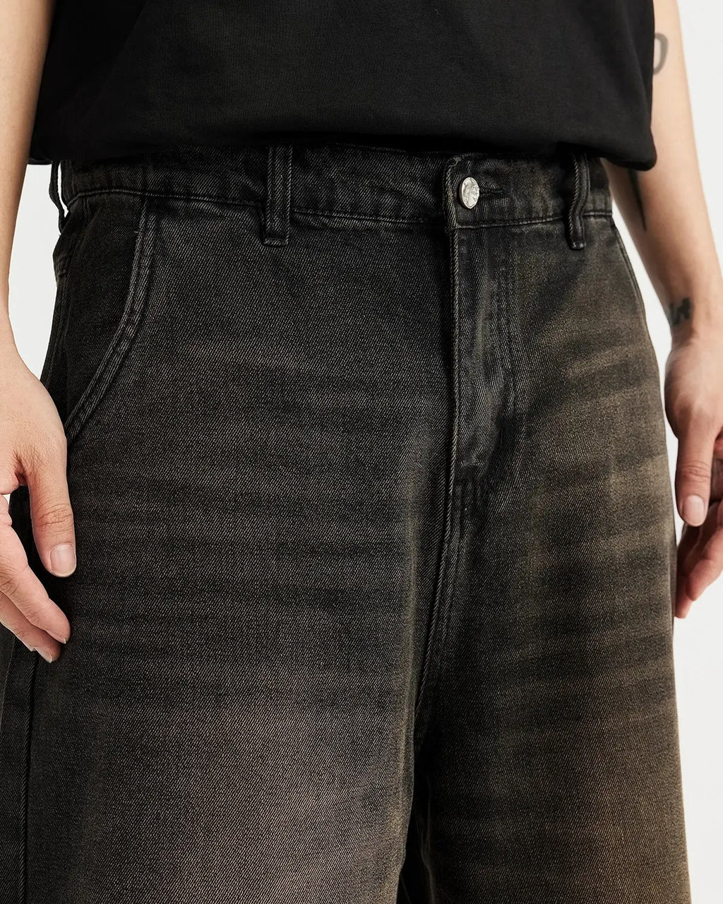 Light-washed retro jeans from Inflation Streetwear featuring distressed denim and a relaxed fit, styled as trendy jorts.