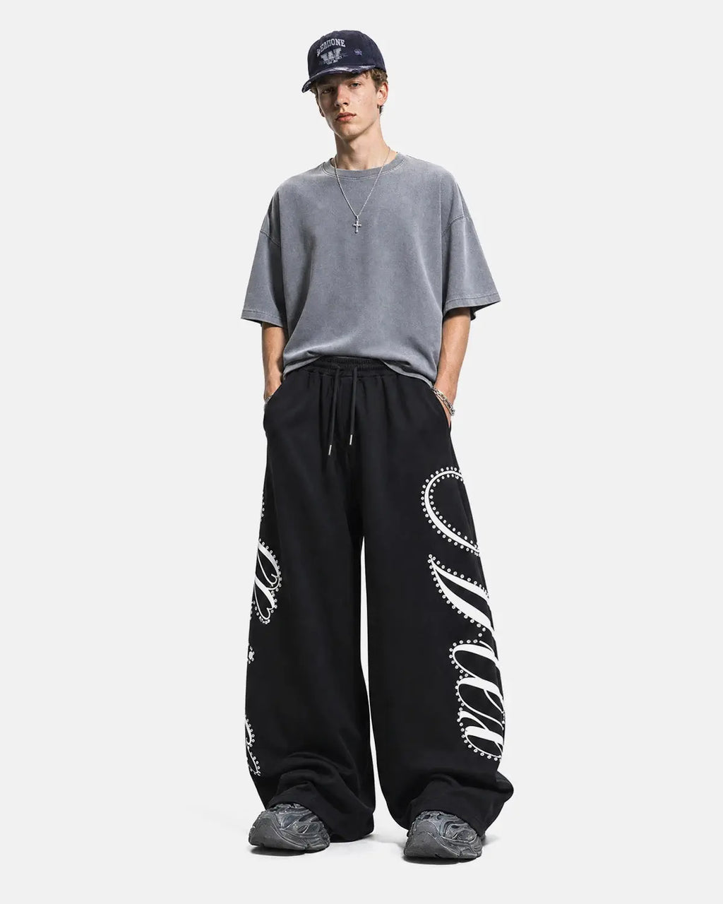 Inflation Rhinestone Script Baggy Sweatpants featuring sparkling rhinestone lettering on casual streetwear style.