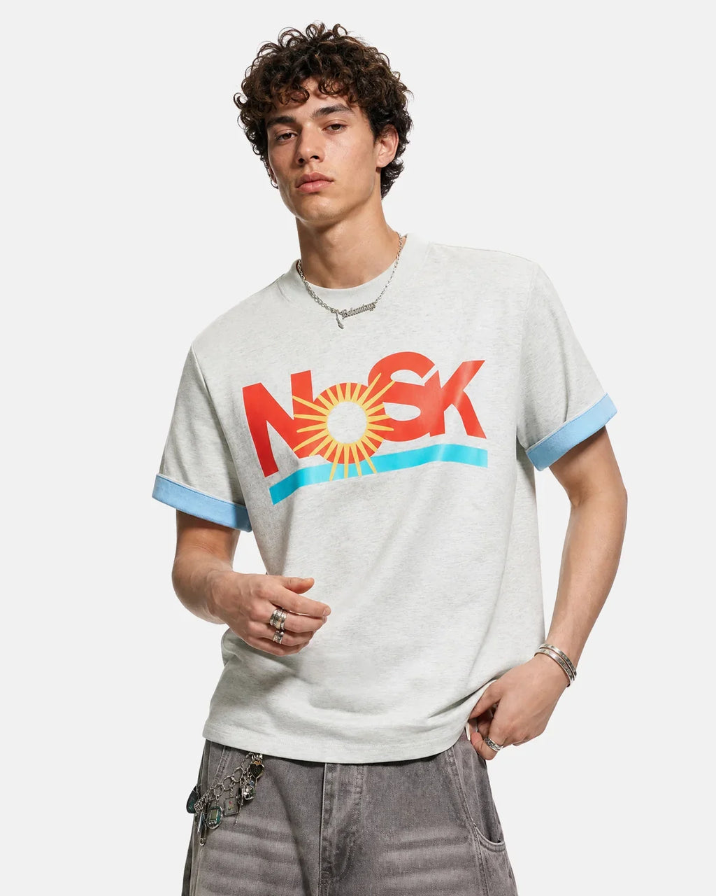Inflation Streetwear graphic layered T-shirt featuring bold print, casual fit, and modern streetwear style in vibrant colors.
