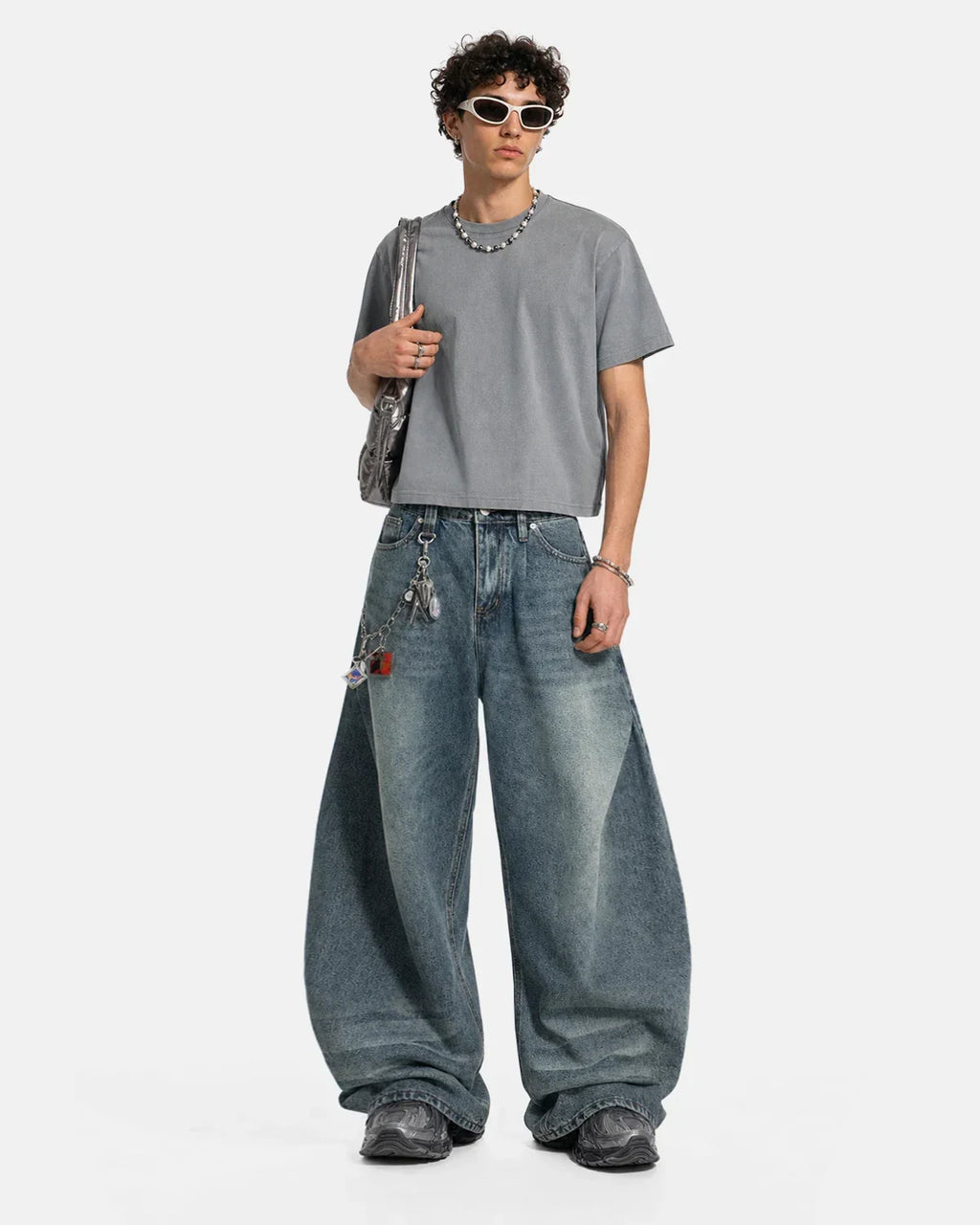 Inflation Whisker Acid Washed Barrel Jeans with distressed detailing and relaxed fit, showcasing trendy streetwear style.