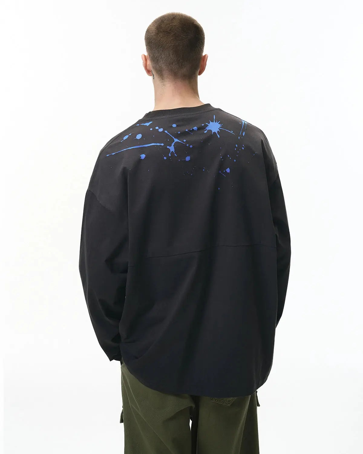 Laser burning streetwear tee by INFLATION featuring bold graphic design on black fabric, casual fit and modern style.