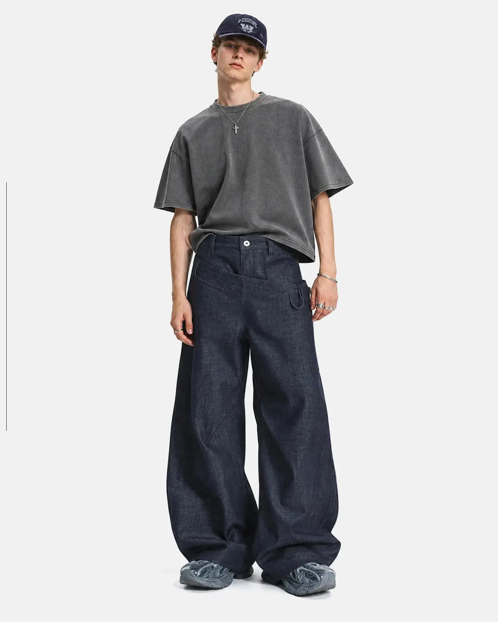 Inflation Streetwear asymmetric wrap waist baggy jeans with loose fit and unique design, shown on a model.