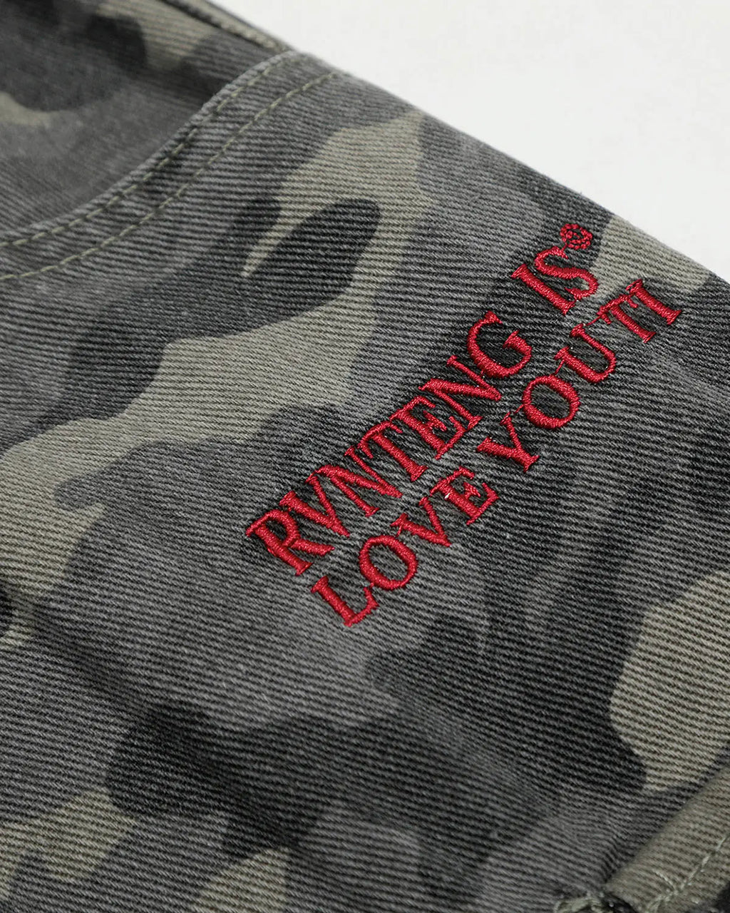 Embroidered camo cargo shorts by INFLATION, featuring a stylish camouflage pattern and multiple cargo pockets.