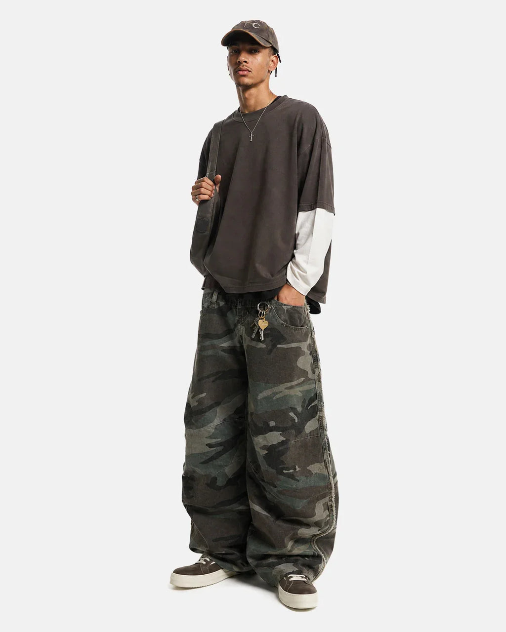 Inflation Streetwear double waist camo cargo pants with multiple pockets and relaxed fit, featuring green and brown camouflage pattern.