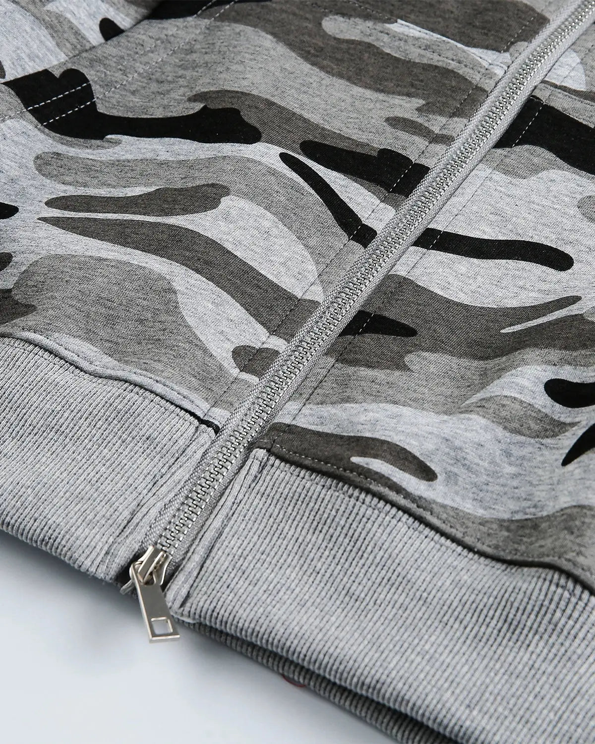 Cropped camouflage zip-up hoodie by INFLATION Streetwear, featuring a green and brown camo pattern and a front zipper.