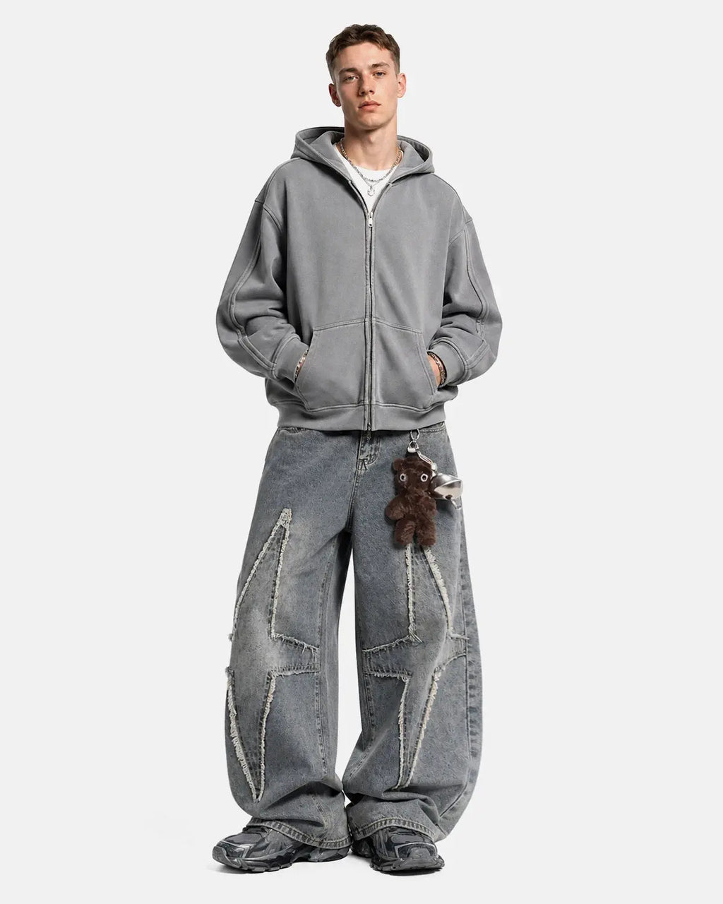 Star patched baggy jeans by INFLATION with distressed details and relaxed fit, styled with casual streetwear look.