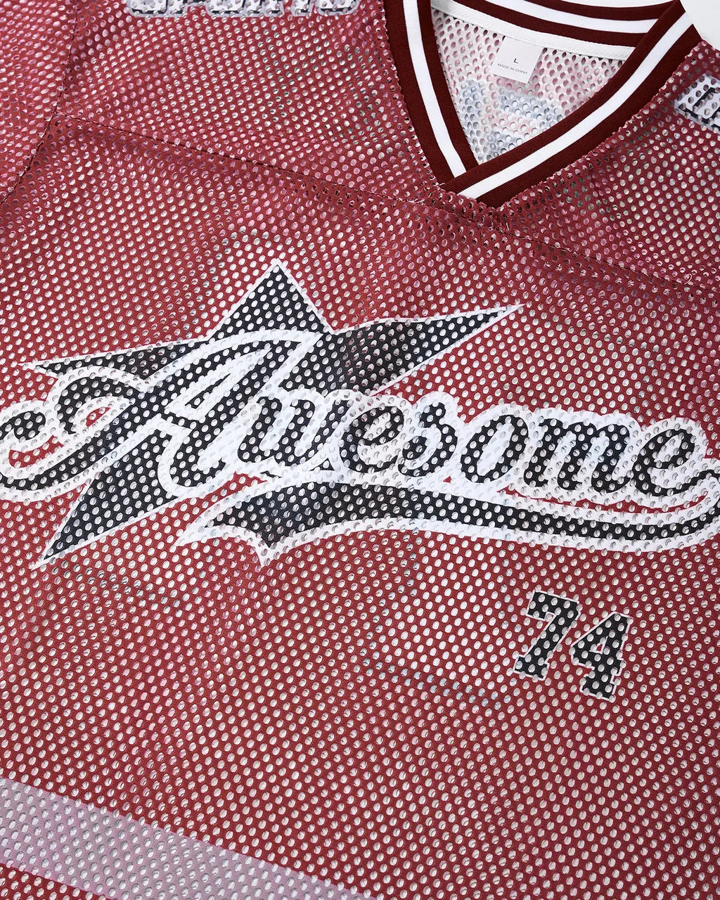 V-neck graphic mesh jersey by INFLATION featuring bold streetwear design and breathable mesh fabric.