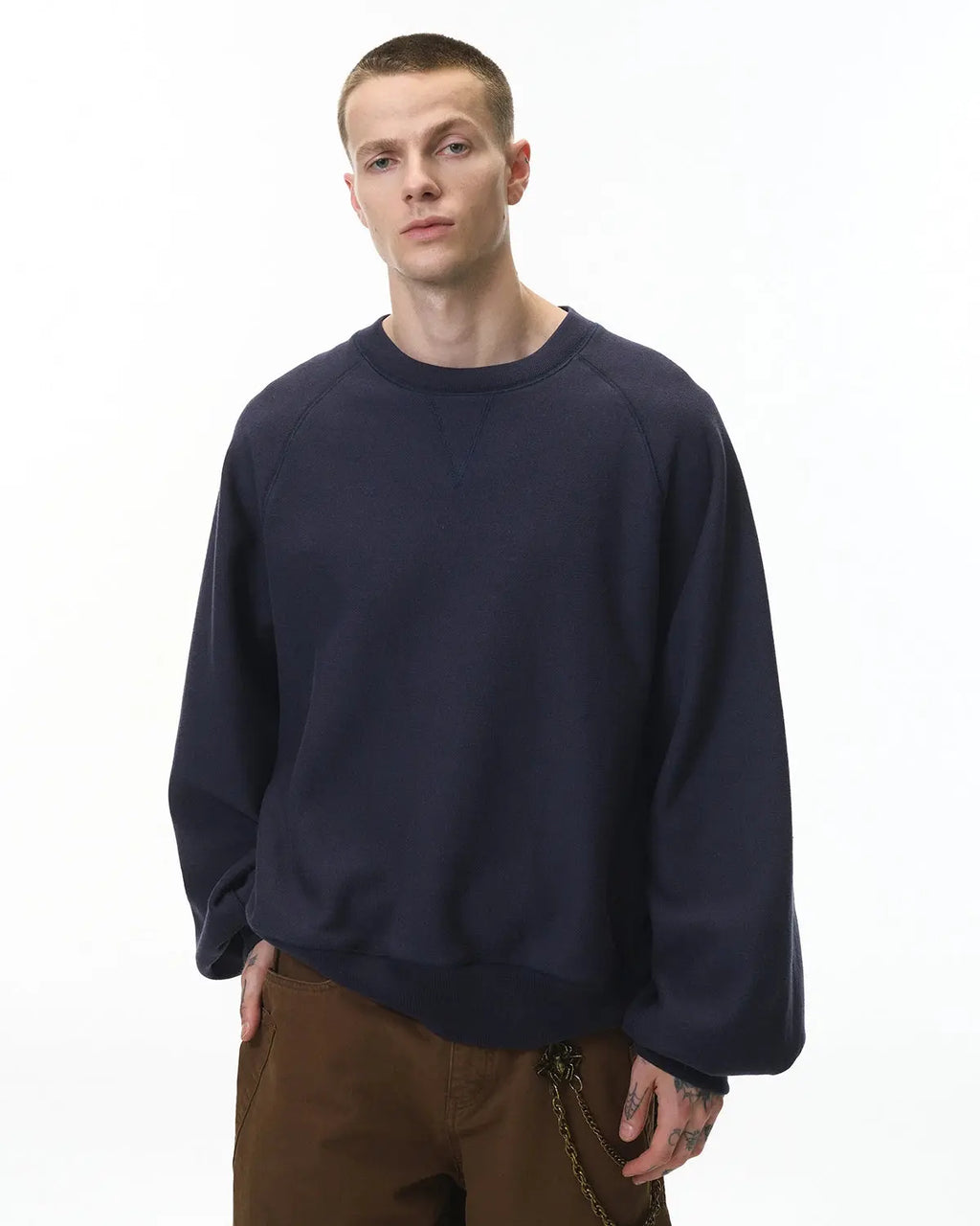 Inflation streetwear batwing sleeve fleece crewneck sweatshirt with a relaxed fit and cozy fabric, shown on a model.