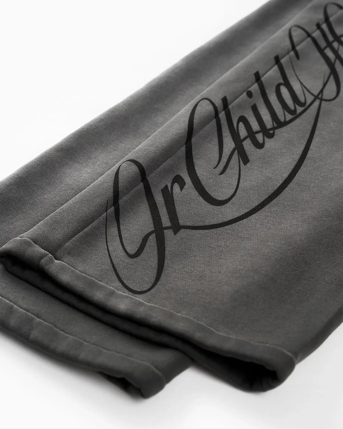 Acid washed black sweatpants by INFLATION with relaxed fit and elastic waistband, casual streetwear style shown in the image.