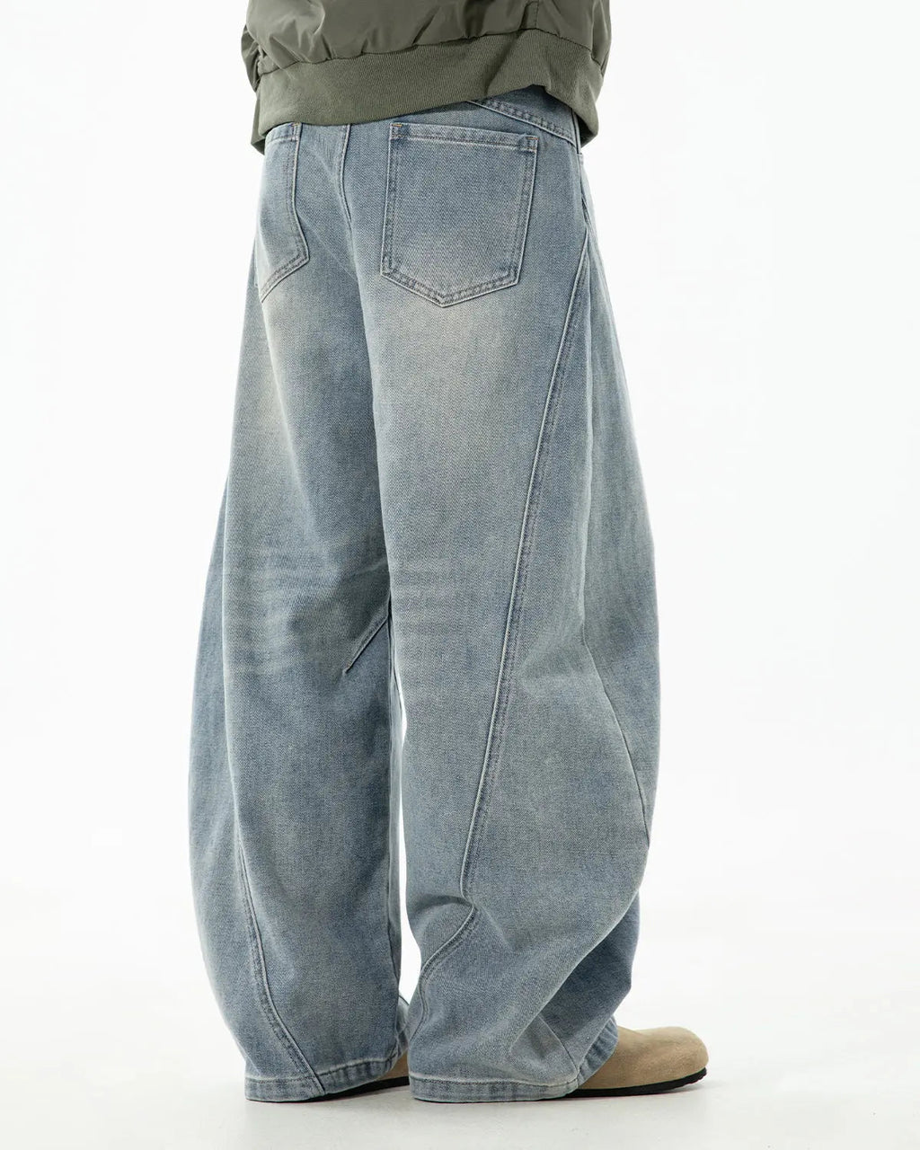 Inflation Streetwear curved seam deconstructed barrel jeans featuring unique stitching and relaxed fit, displayed on a mannequin.
