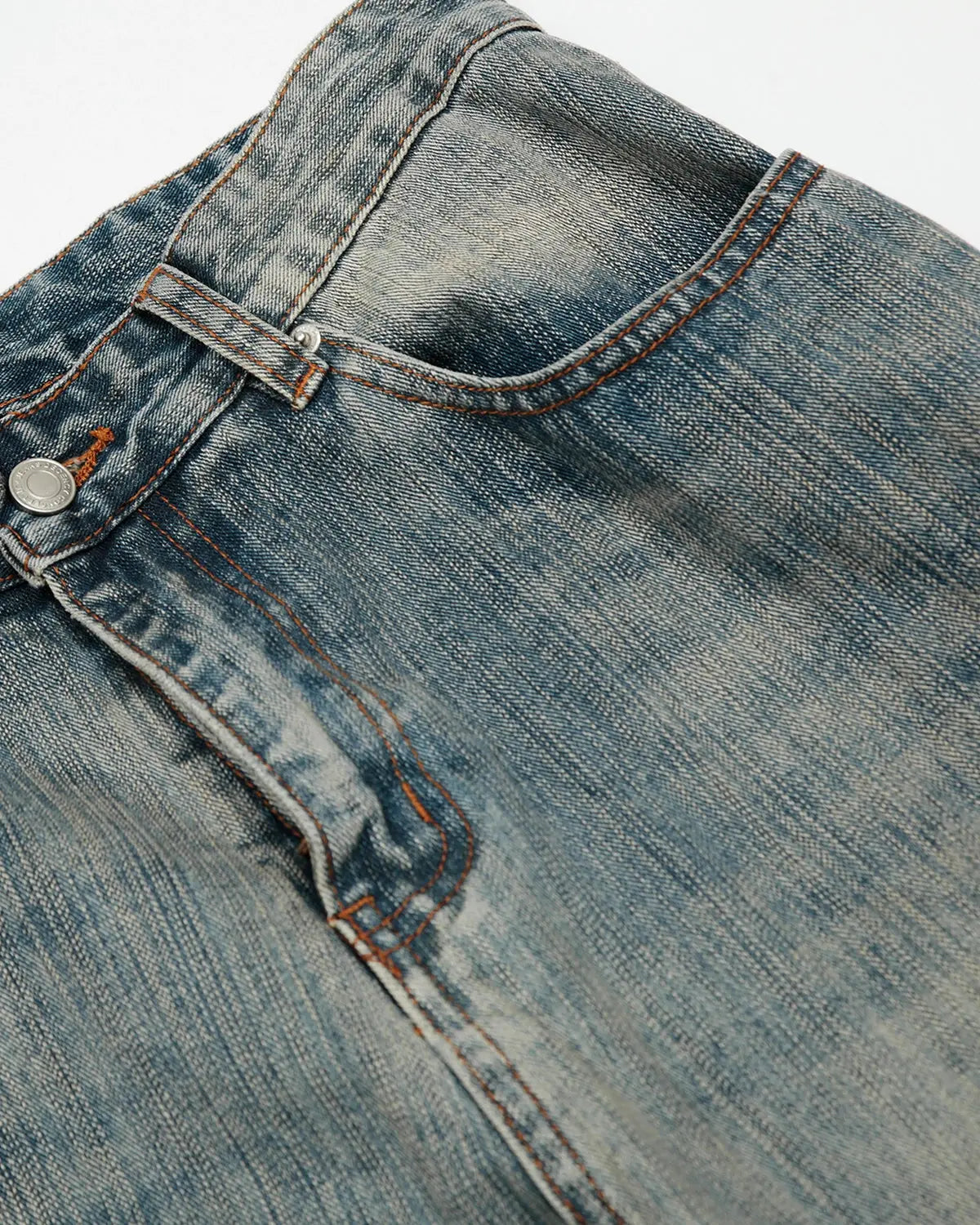 Washed bamboo weave baggy bootcut jeans by INFLATION, showing relaxed fit, light wash denim, and wide leg silhouette.