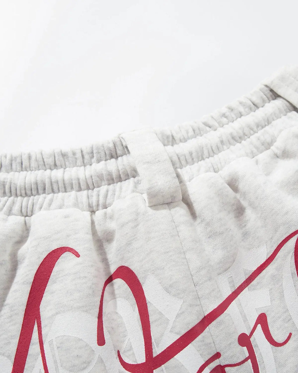Gothic Script Baggy Sweatpants by INFLATION, black streetwear with bold gothic lettering, relaxed fit and comfortable fabric.