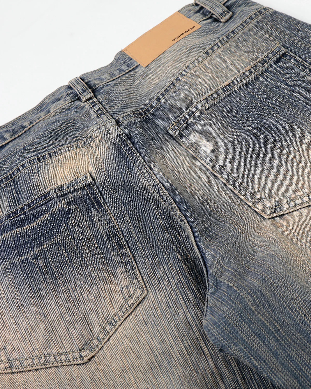 Inflation Streetwear bamboo weave dirty wash jeans showing distressed denim, slim fit style, and textured fabric details.