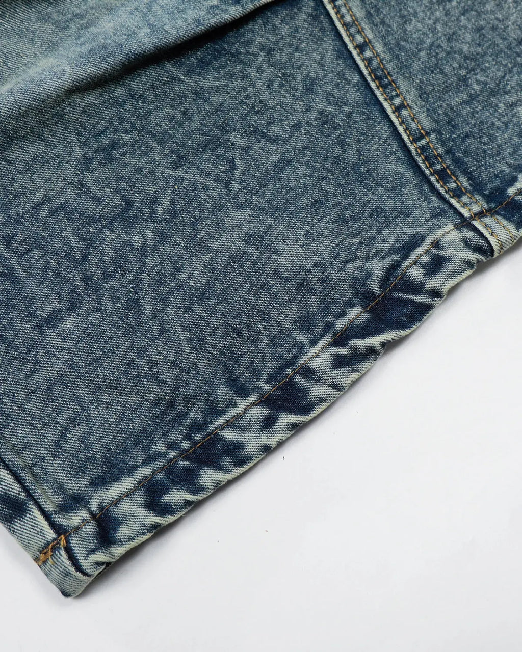 Inflation brand studded washed long baggy jorts, denim pants with metal stud embellishments and a relaxed, oversized fit.