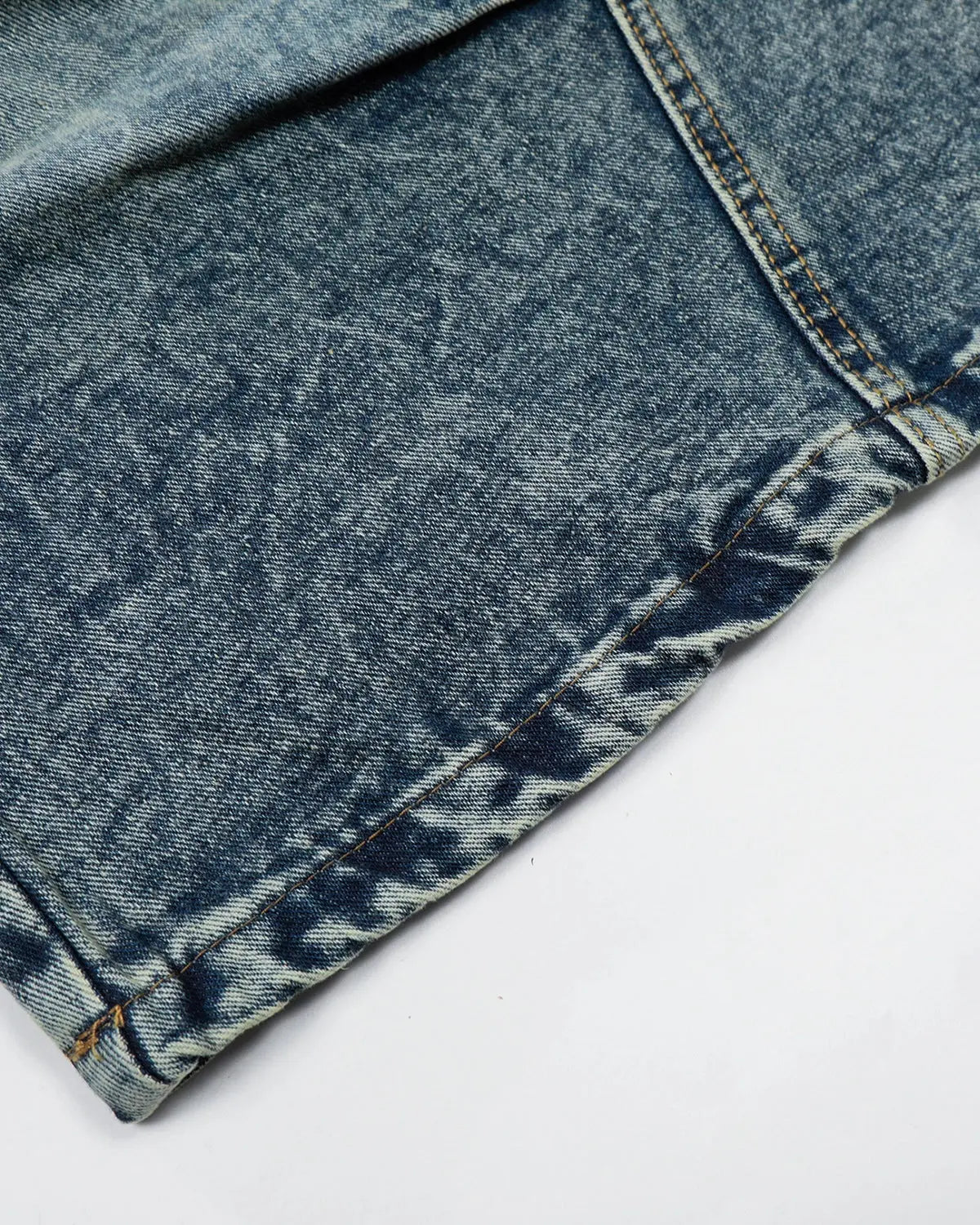 Inflation brand studded washed long baggy jorts, denim pants with metal stud embellishments and a relaxed, oversized fit.