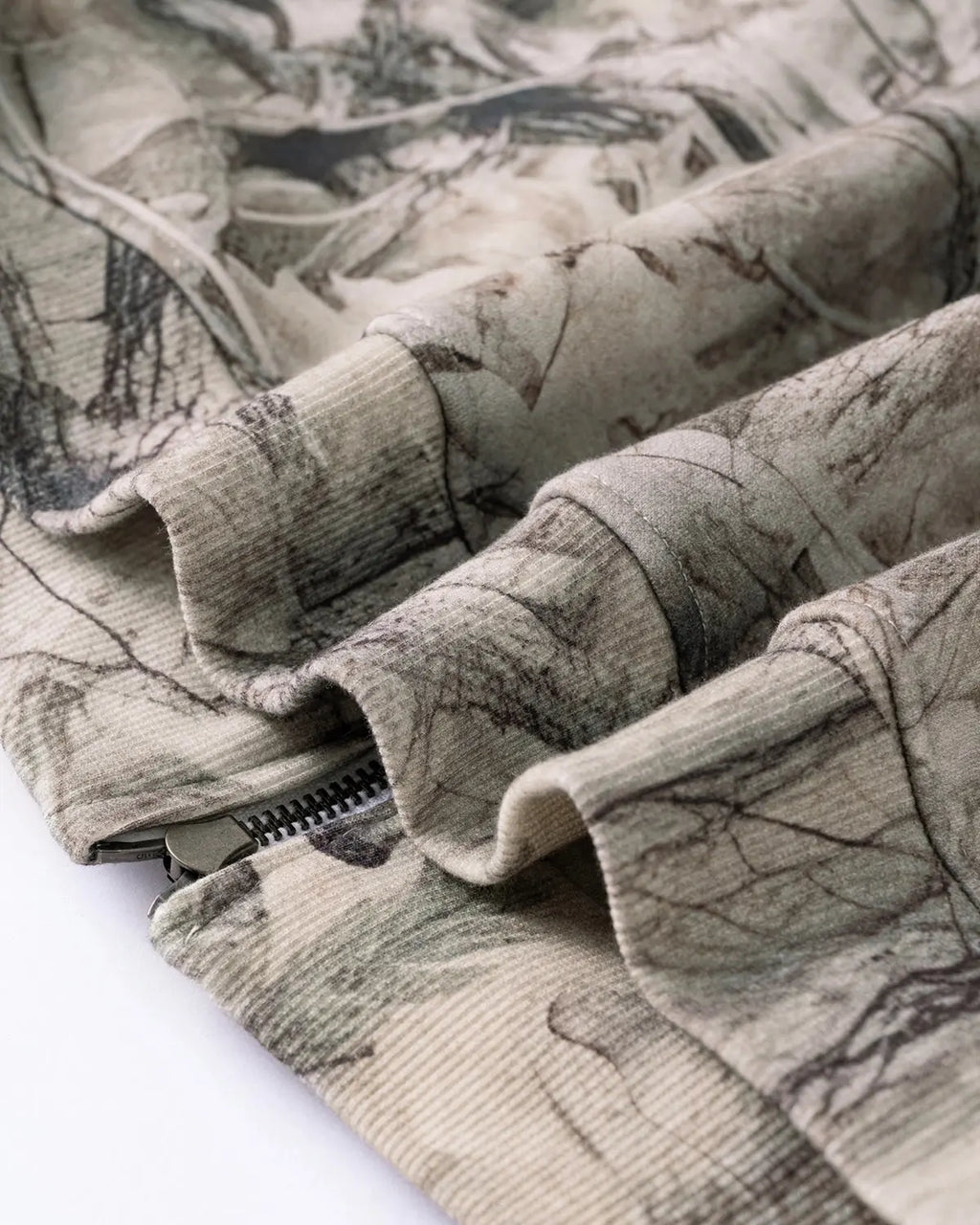 Inflation Streetwear Realtree camo zip-up hoodie with front pockets and hood, featuring a camouflage pattern and branded logo.