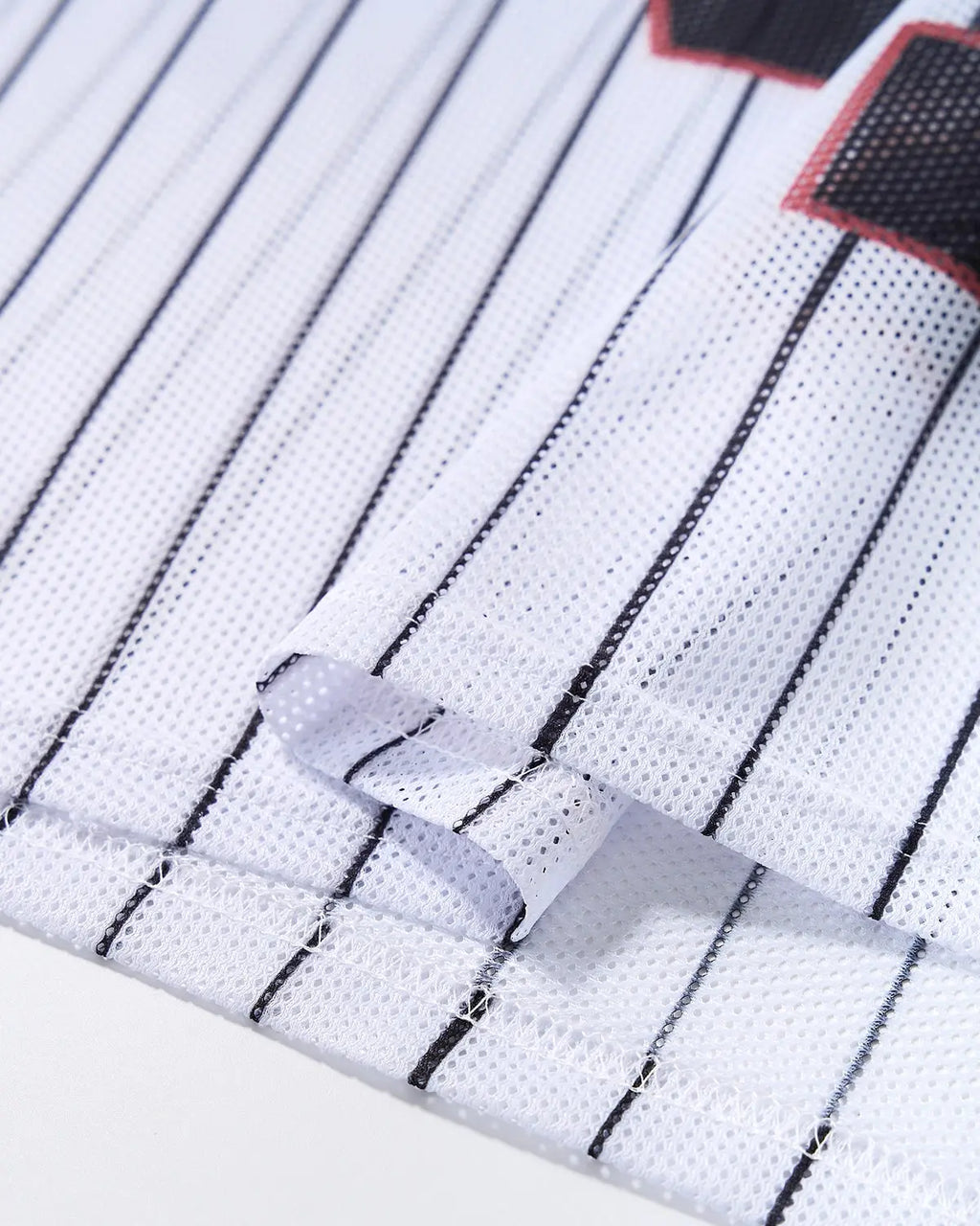 Pinstripe number mesh jersey by INFLATION, streetwear style with a lightweight mesh fabric and bold pinstripe design.