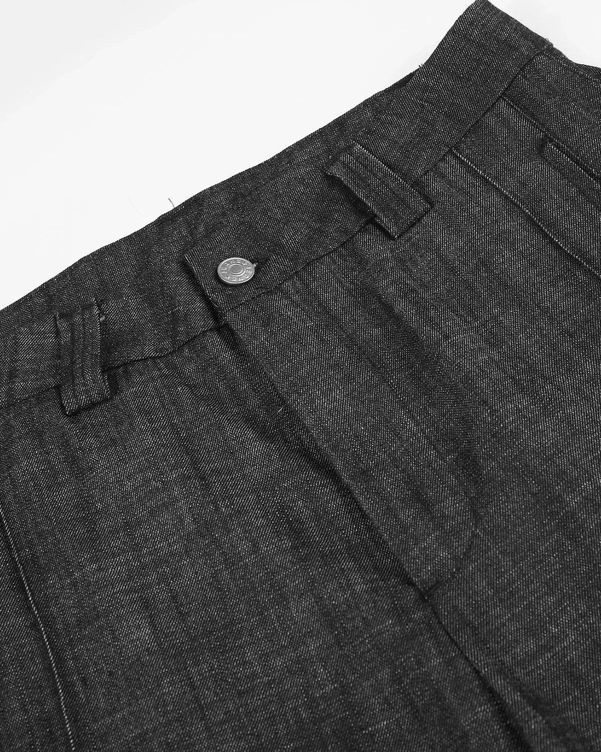 Lightweight structured barrel jeans by INFLATION, showing a close-up of the textured denim fabric and relaxed fit style.