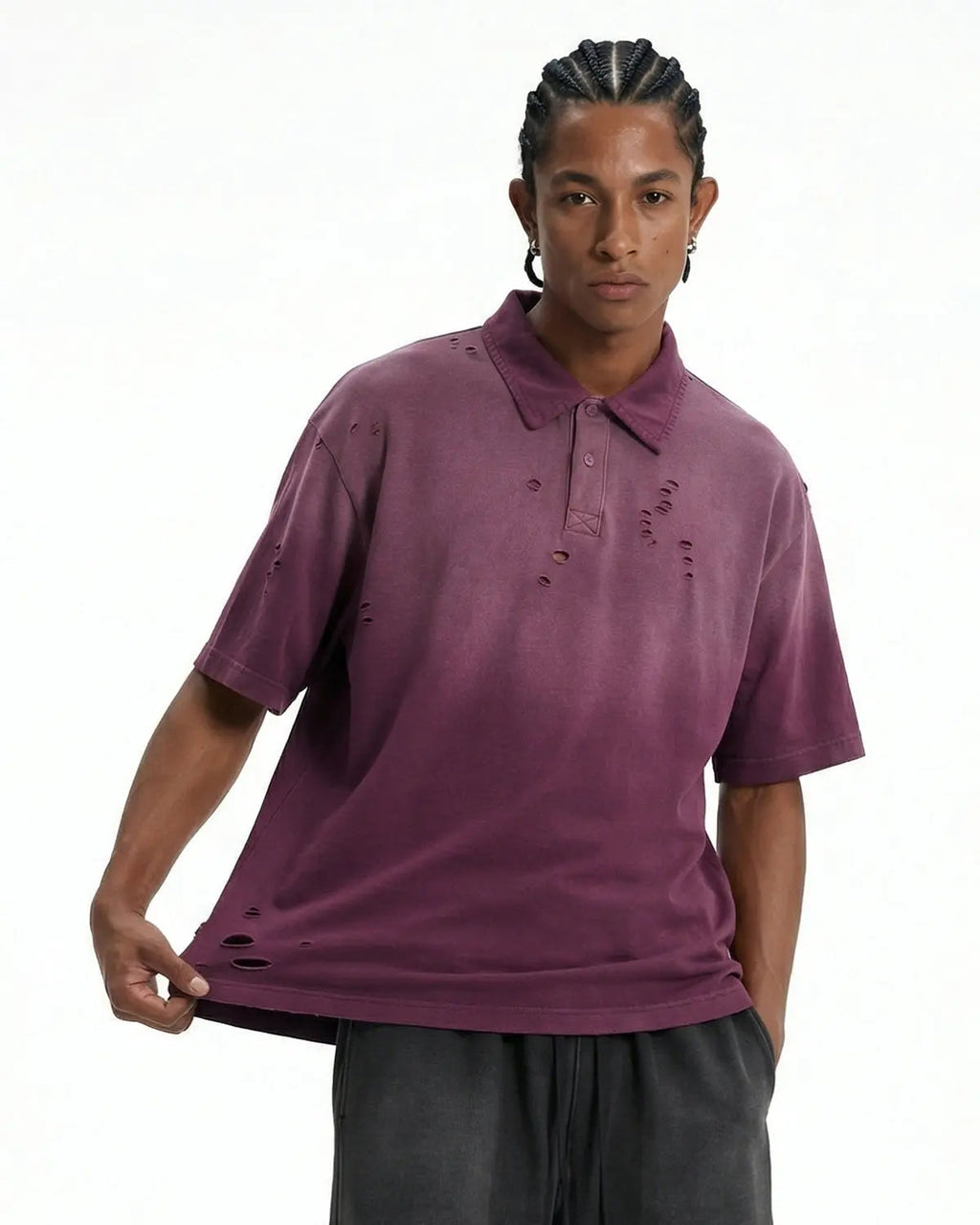 Distressed ripped washed polo shirt by INFLATION, featuring a casual, vintage-inspired design with frayed edges and faded fabric.