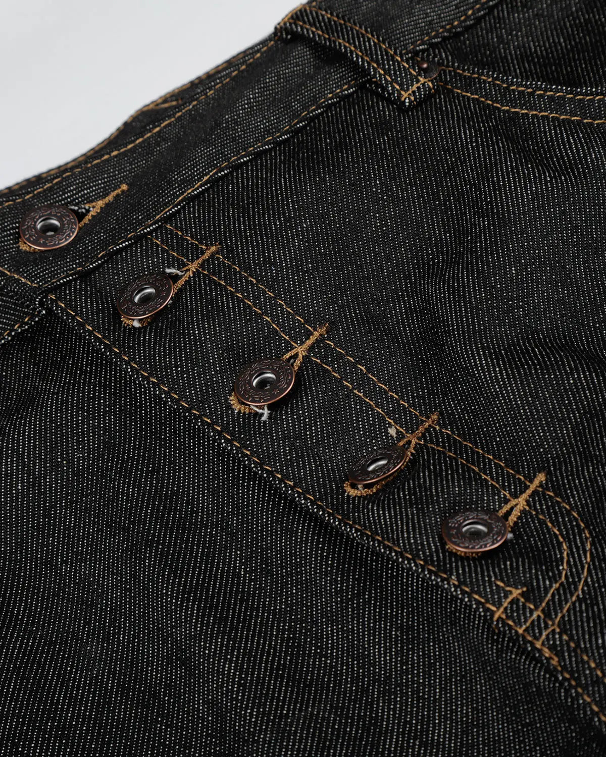 Inflation Streetwear Button Fly Raw Baggy Jeans with relaxed fit, featuring visible button fly closure and raw hem detail.