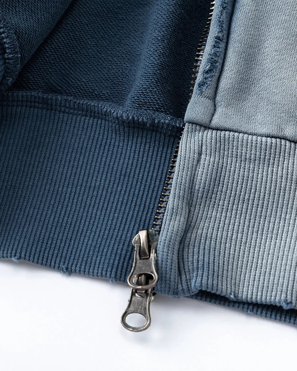 Blue distressed acid wash zip-up hoodie by INFLATION Streetwear, featuring a casual fit and rugged, stylish design.
