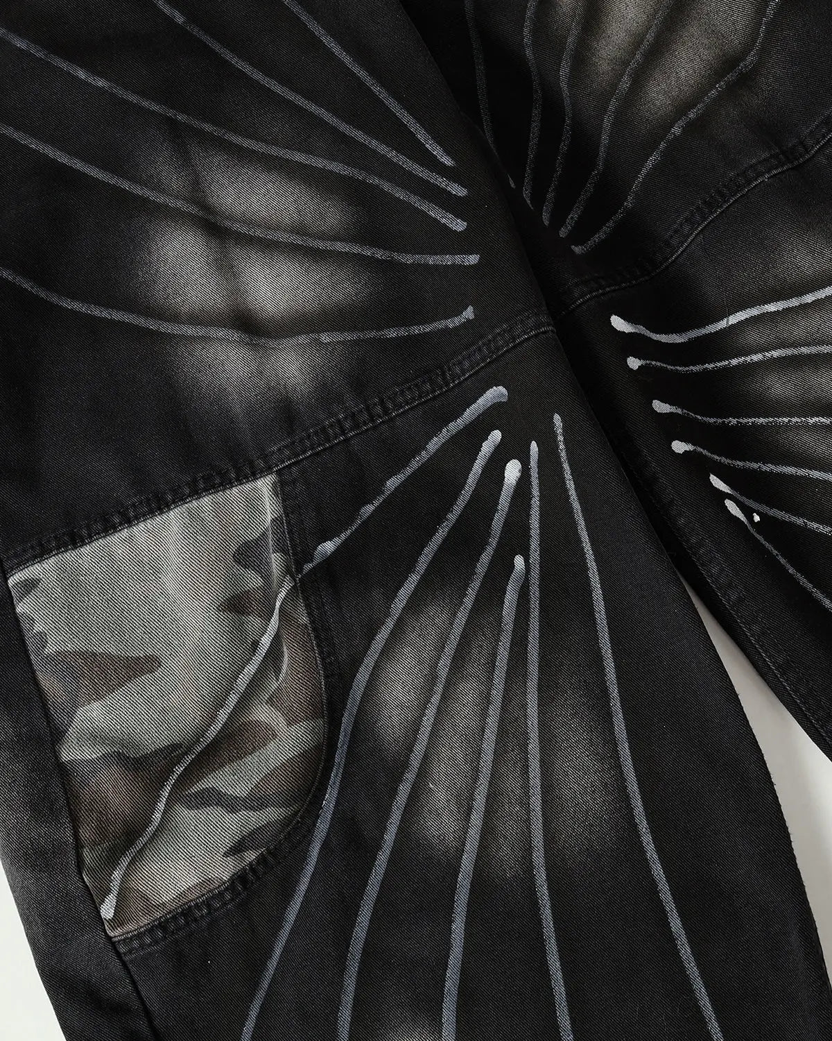Inflation Spray Graphic Camo Barrel Jeans, men's streetwear pants with bold spray paint camo design and relaxed fit.