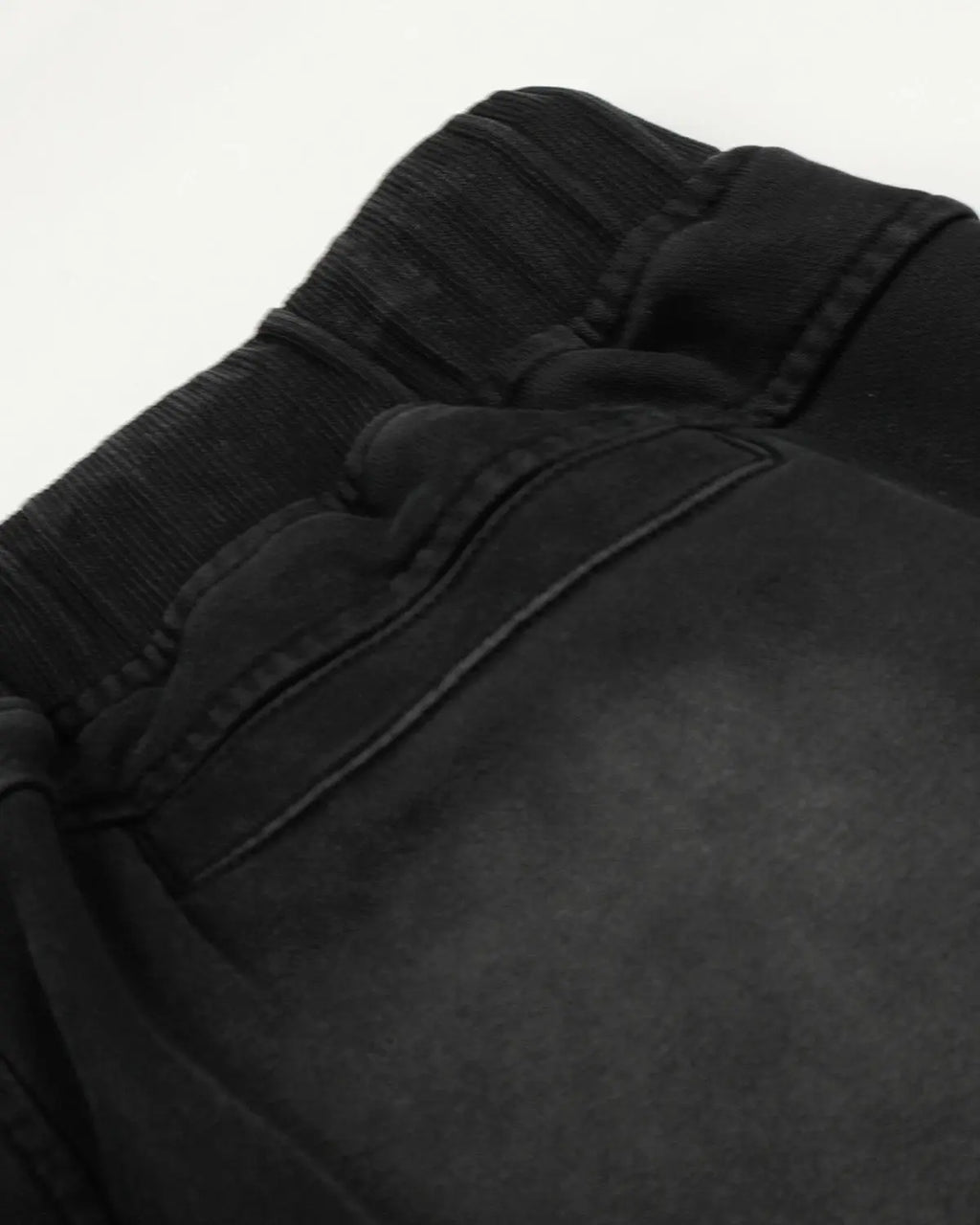 Distressed washed baggy sweatpants from INFLATION streetwear with a relaxed fit and faded, worn-in look.