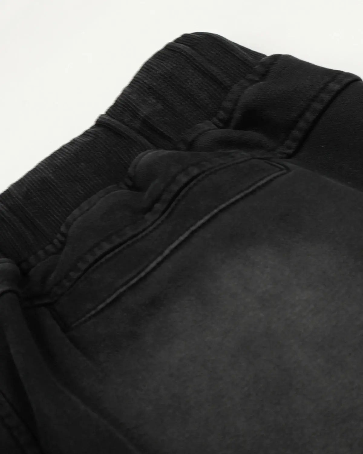 Distressed washed baggy sweatpants from INFLATION streetwear with a relaxed fit and faded, worn-in look.