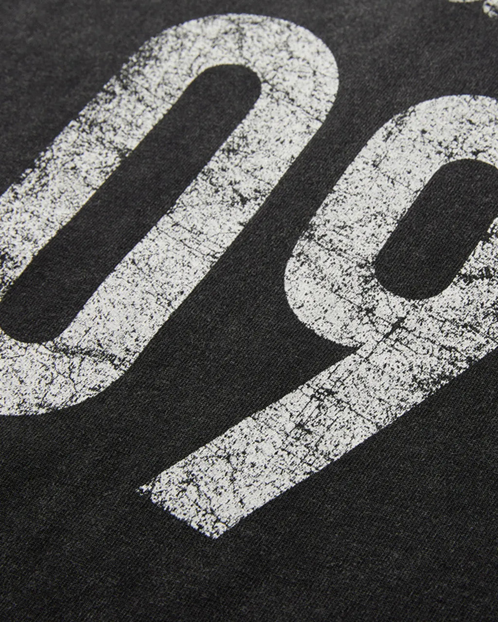 Distressed spray wash graphic T-shirt by INFLATION featuring a vintage-inspired streetwear design and faded graphic print.