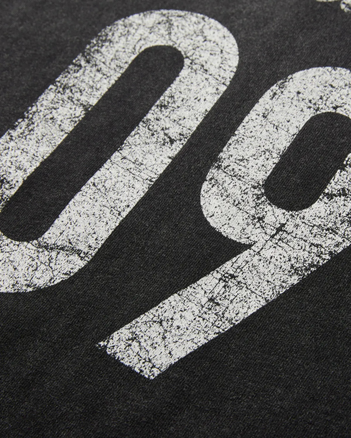 Distressed spray wash graphic T-shirt by INFLATION featuring a vintage-inspired streetwear design and faded graphic print.