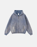 Acid washed zip-up hoodie by INFLATION, streetwear style, featuring a relaxed fit with a faded, distressed look and front zipper.