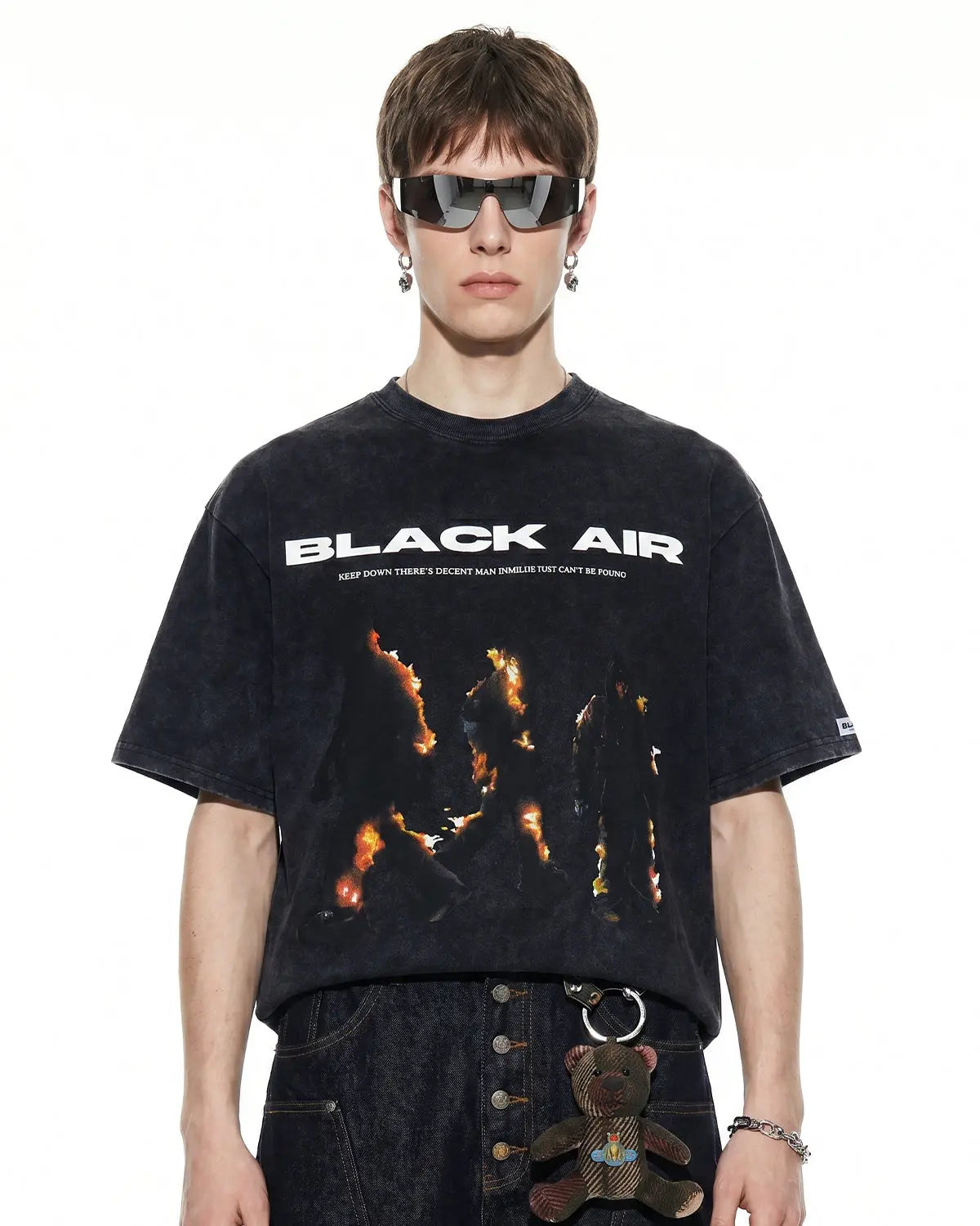 Oversized washed graphic T-shirt by INFLATION featuring bold print and relaxed fit, displayed on a neutral background.