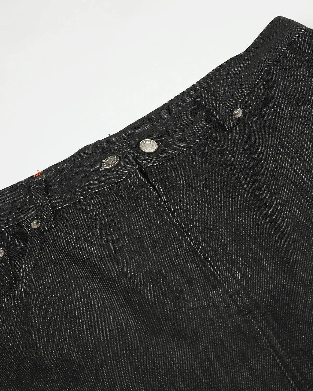 Black cargo longline jorts by INFLATION, stylish denim shorts with cargo pockets and a longline fit, designed for streetwear fashion.