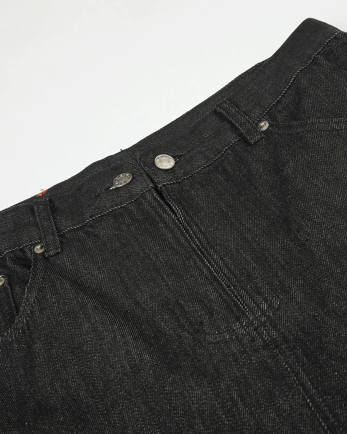 Black cargo longline jorts by INFLATION, stylish denim shorts with cargo pockets and a longline fit, designed for streetwear fashion.