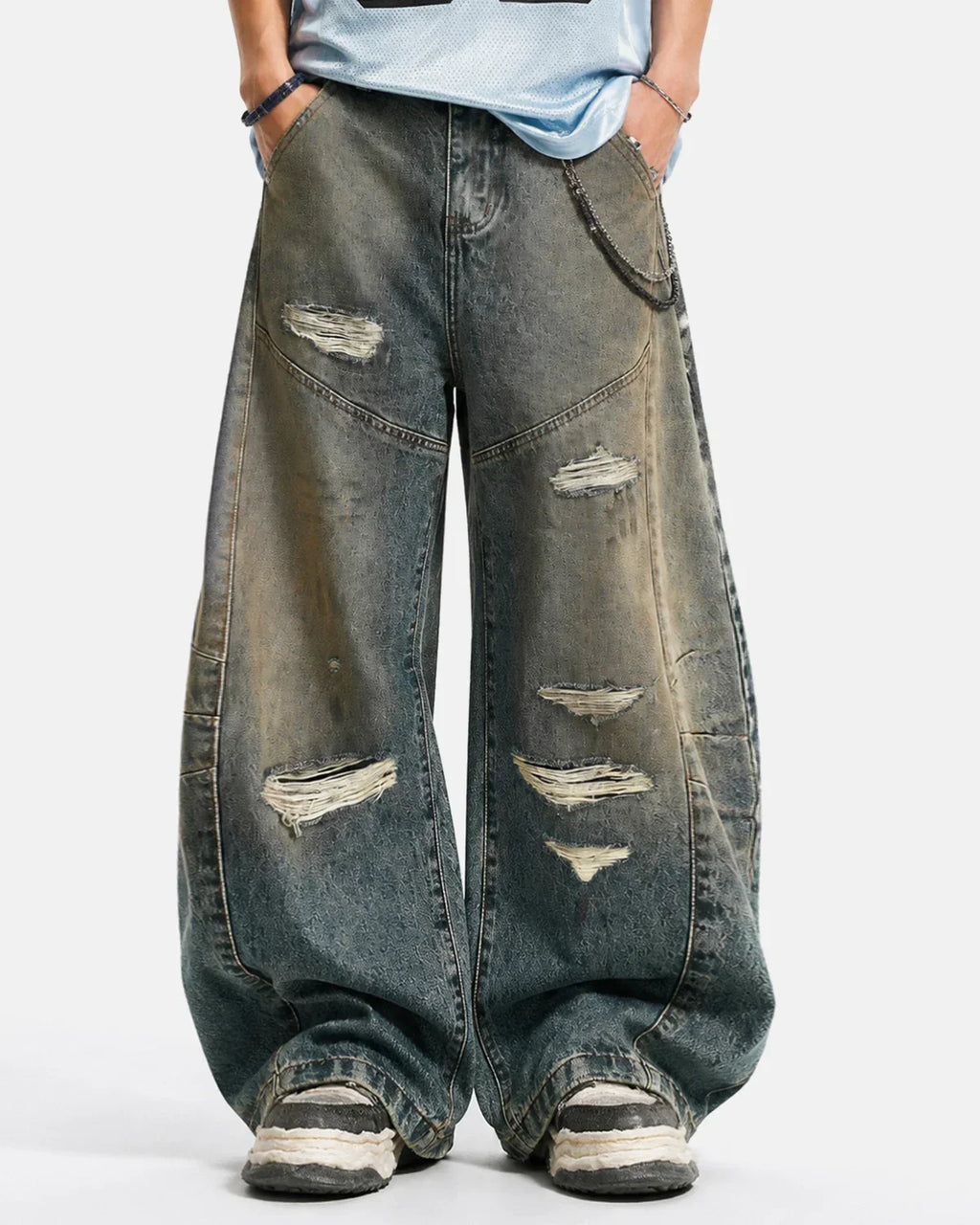 Distressed Dirty Wash Barrel Jeans by INFLATION featuring ripped details and a slim fit, casual streetwear style.