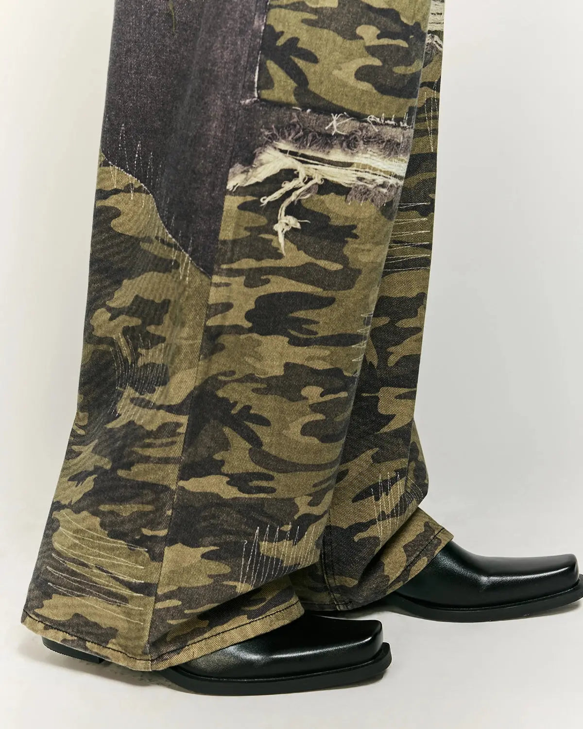 Camo digital printing baggy jeans by INFLATION, streetwear style, featuring a relaxed fit and digital camouflage pattern.