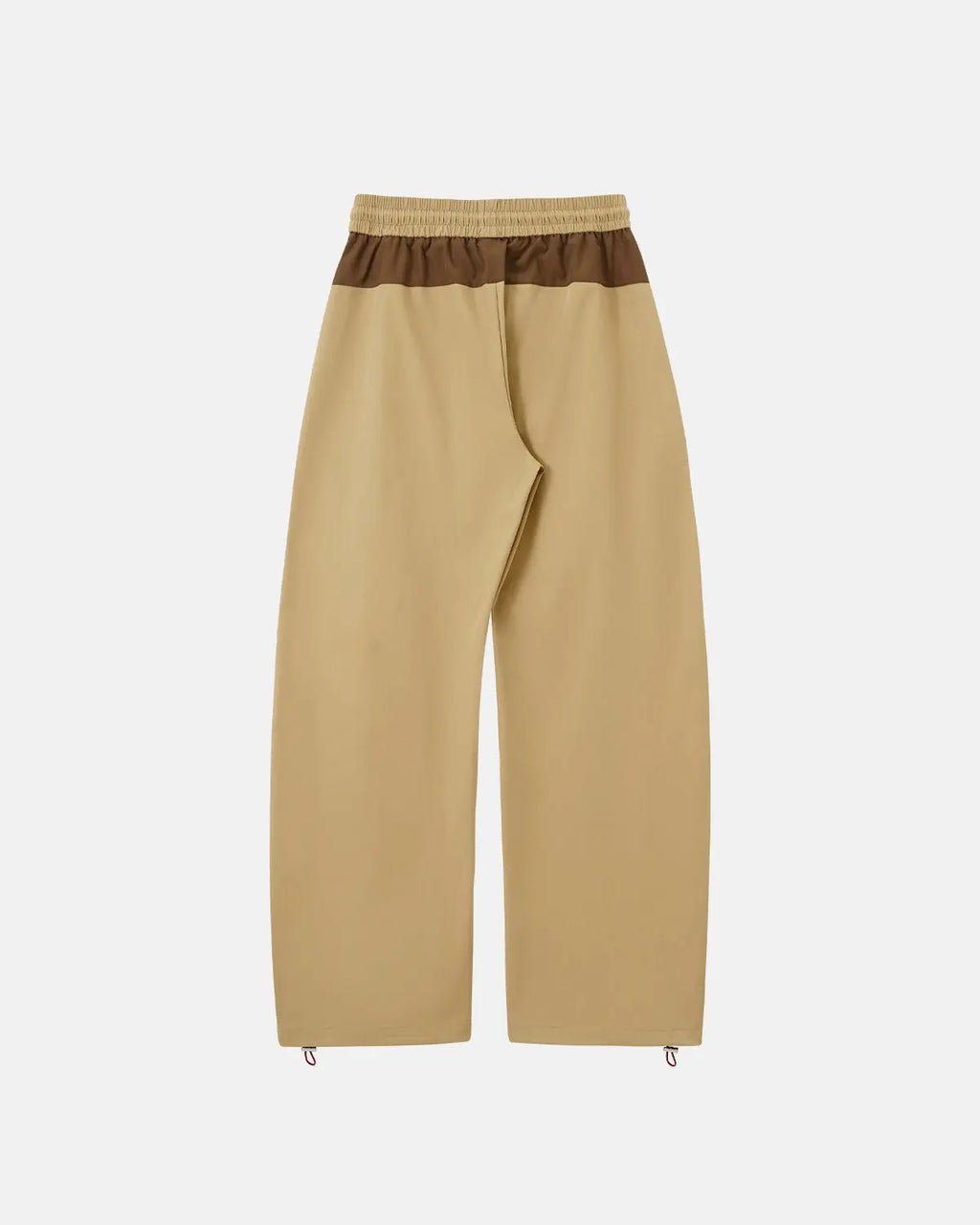 Reflective windbreaker track pants by INFLATION featuring a sleek design, reflective accents, and a comfortable fit for streetwear style.