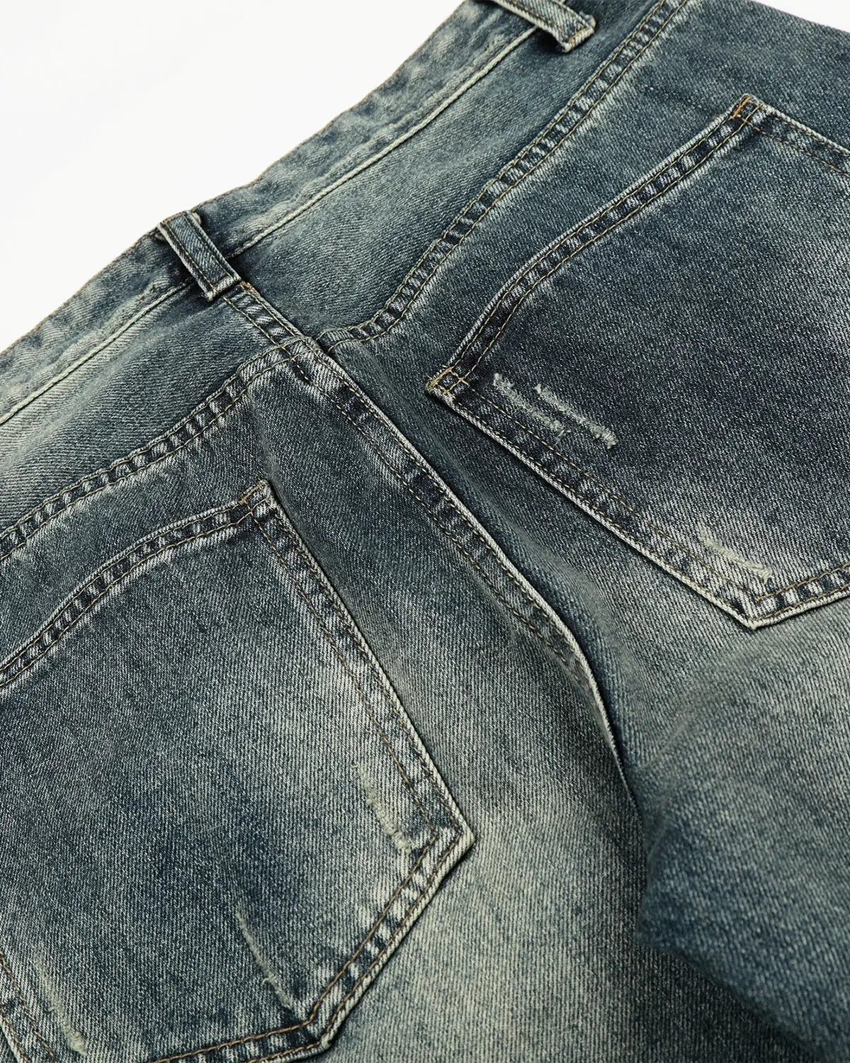 Acid washed ripped baggy barrel jeans by INFLATION, streetwear style with distressed details and relaxed fit, shown on a model.