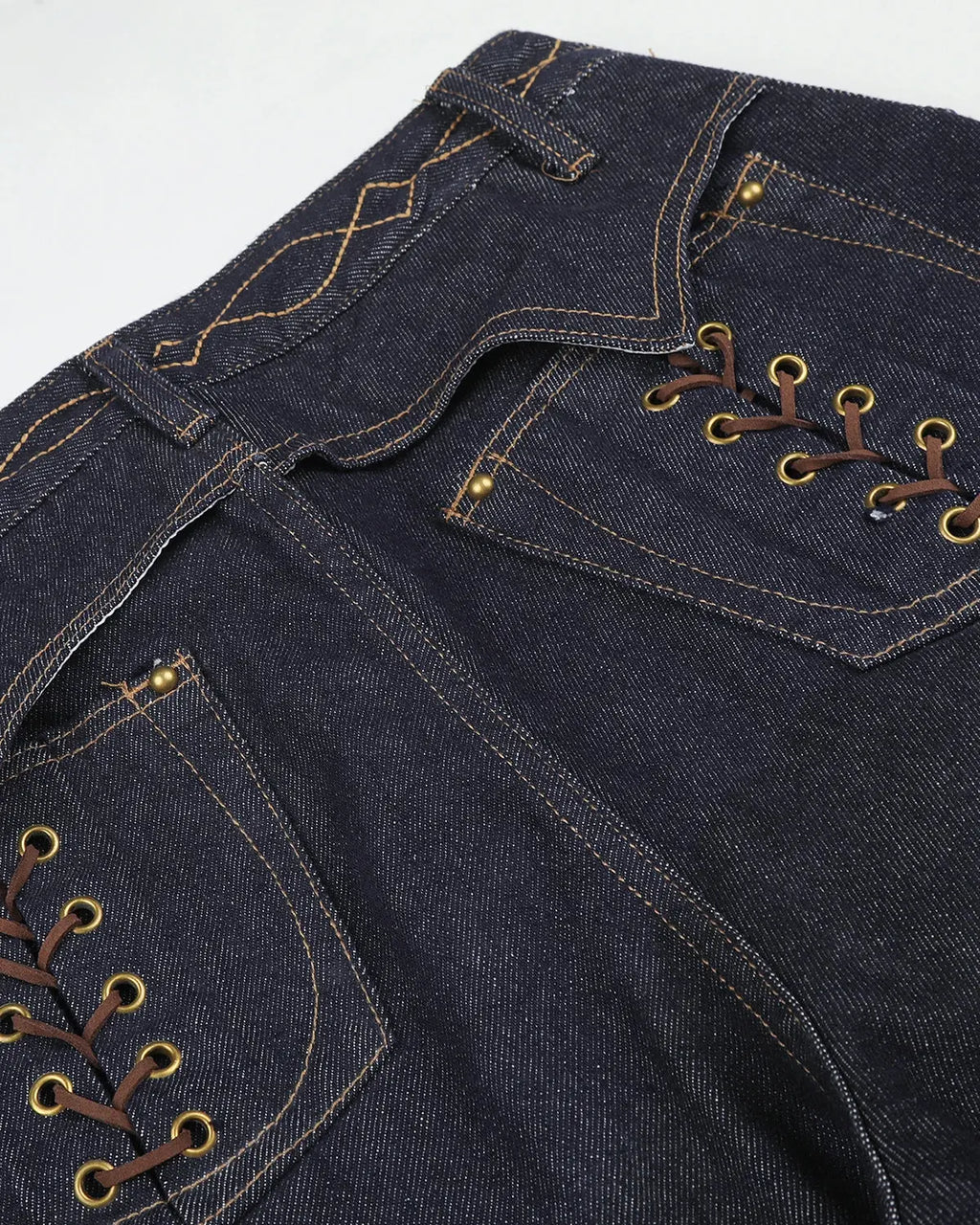 Raw baggy jeans with side lace-up details from INFLATION's streetwear collection, shown in a relaxed fit on a model.