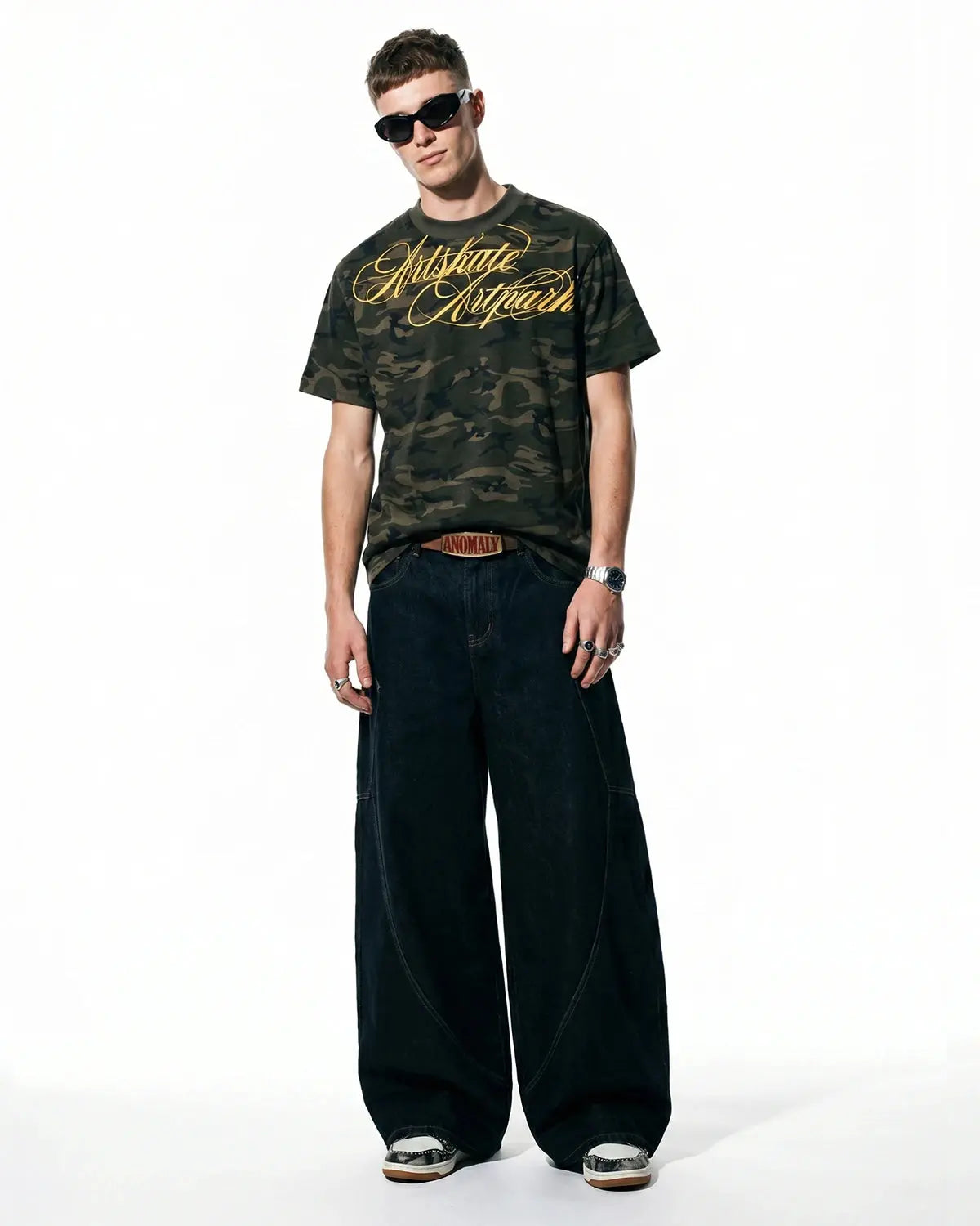 Camo Script Boxy T-Shirt by INFLATION featuring camouflage pattern and casual oversized fit, shown on a model.
