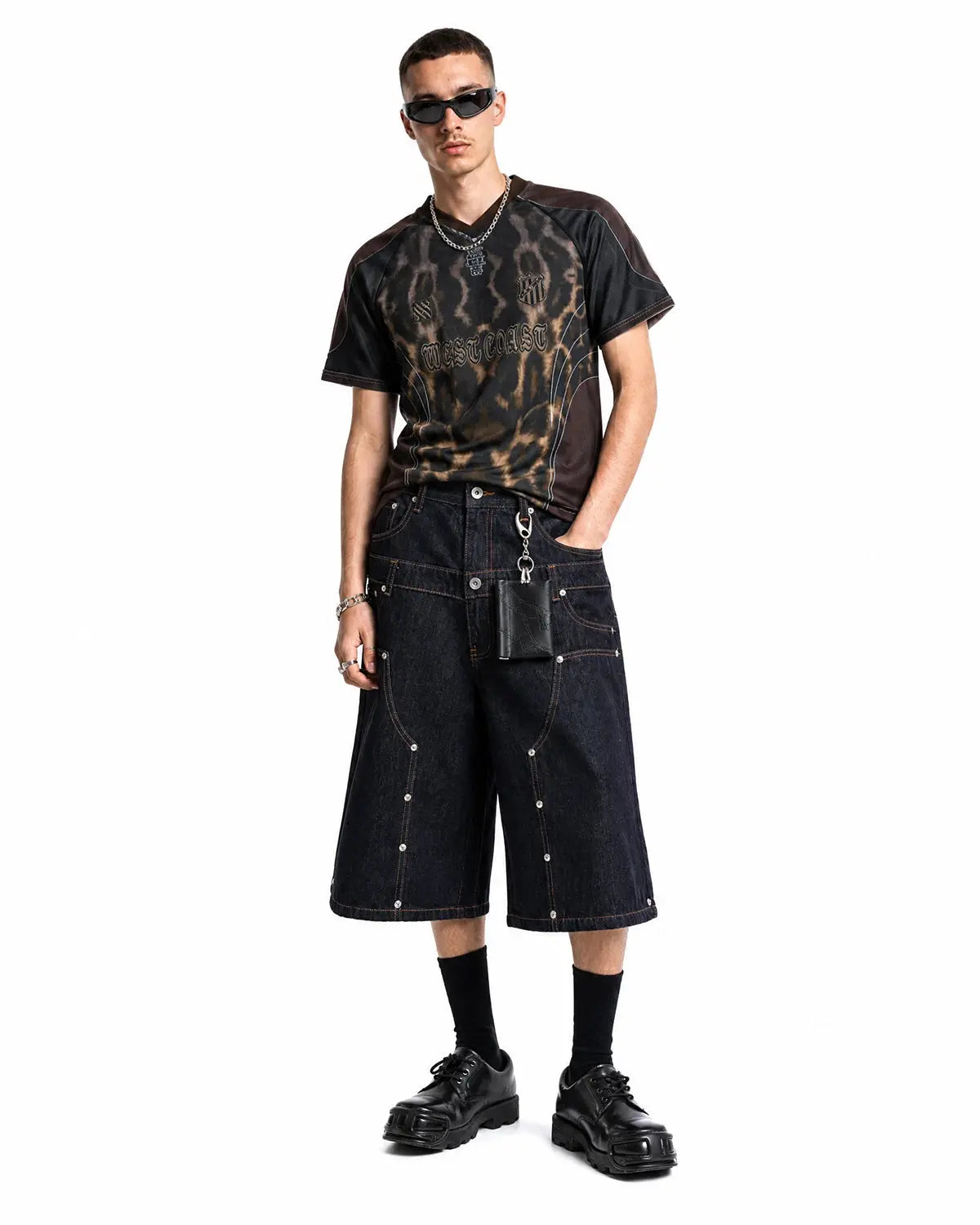 Inflation brand double waist rivet baggy jorts, denim pants with rivet accents and a relaxed, oversized fit displayed on model.