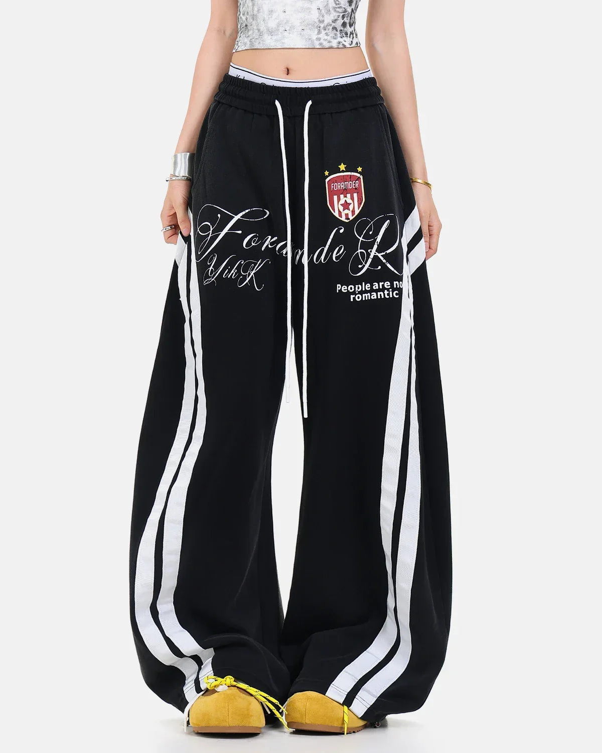 Inflation Streetwear washed stripe barrel sweatpants with a relaxed fit and bold stripe pattern, made from comfortable fabric.