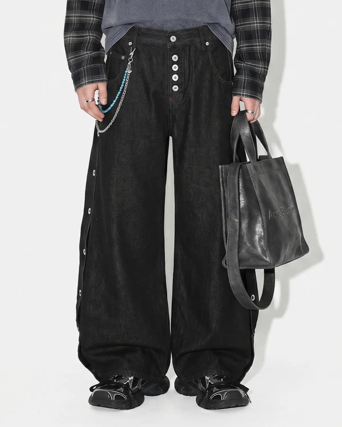 Inflation Streetwear barrel jeans with side eyelet buttons, showcasing distressed denim and stylish details.